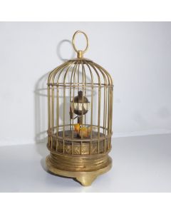 Uhr mit beweglichem Vogel im Käfig um 1920